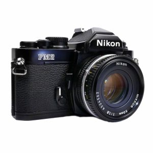 Nikon FM-2n black (FM2B/FAA140NC) + Nikon 50 mm / 1.8 AIS (FL180/JAA006AC) | Clean-Cameras.ch