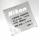 Nikon Original Gegenlichtblende HK-1 zu 28-45mm | Clean-Cameras.ch