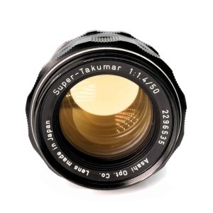 Asahi Pentax Super-Takumar 50mm f/1.4 M42 Objektiv Frontansicht mit sichtbarem gelbem Thorium-Glas